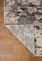 Blue book on gray and white striped wool rug with textured surface