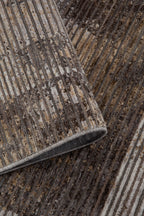 Modern geometric striped rug in grey, taupe and cream tones with distressed texture