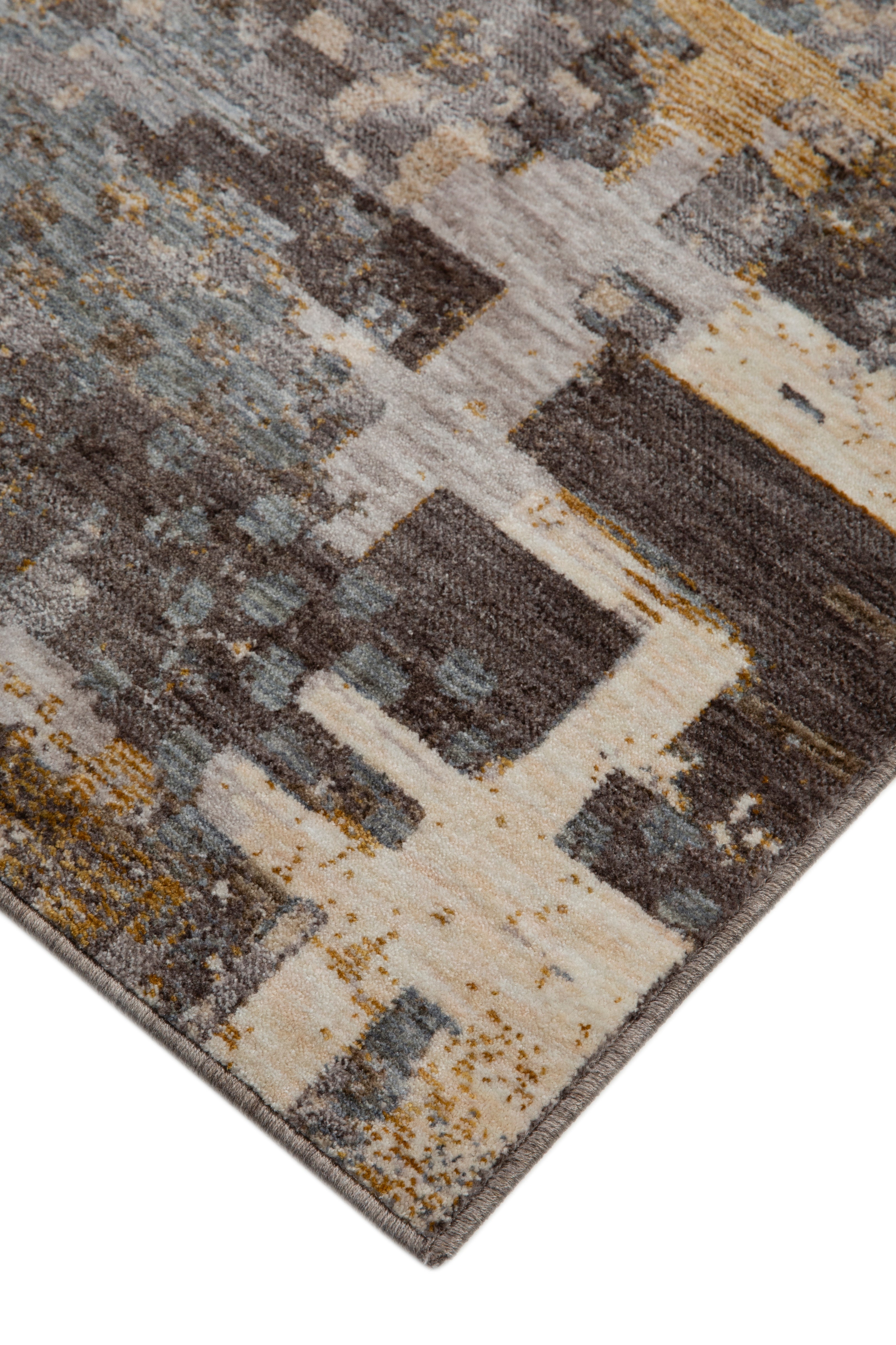 Abstract distressed rug with gold, grey, and brown pixelated pattern texture