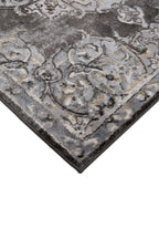Ornate Persian-style rug with symmetrical medallion pattern in black, gray and cream tones