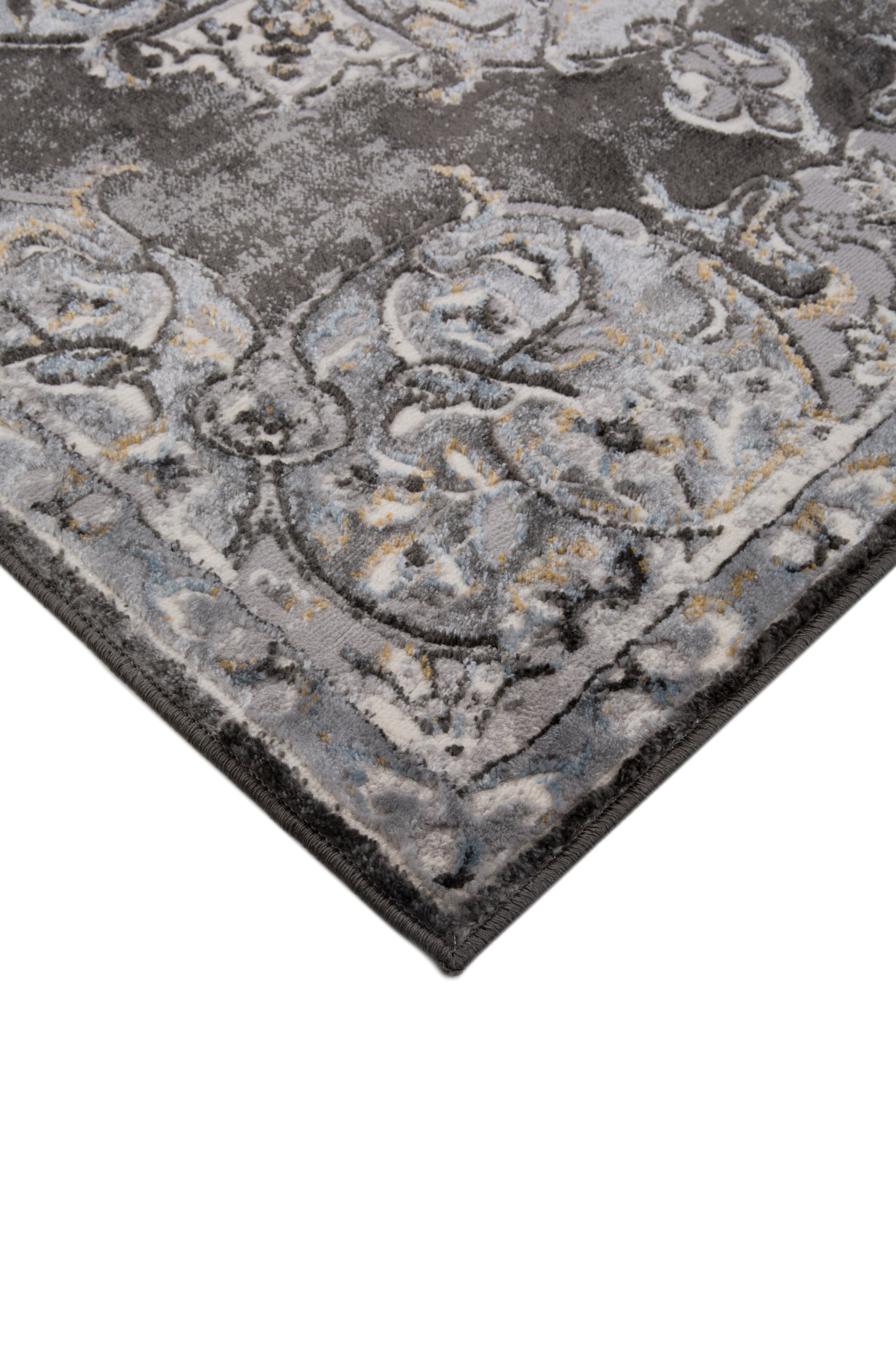 Ornate Persian-style rug with symmetrical medallion pattern in black, gray and cream tones