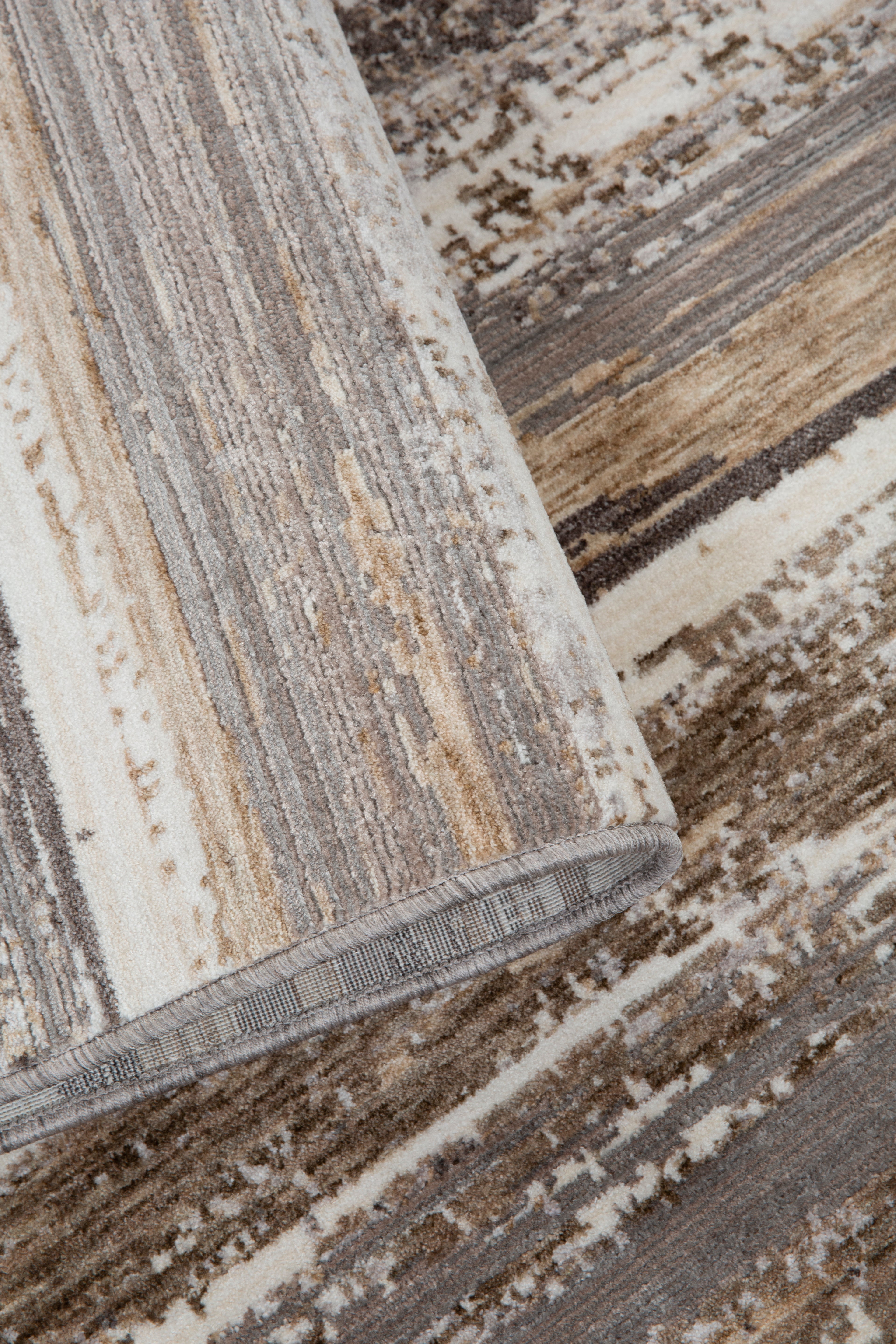 Distressed striped rug with weathered wood texture in brown and cream tones
