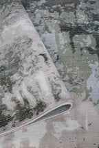 Distressed vintage rug with muted green, beige and grey abstract texture pattern