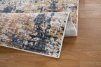Abstract distressed rug with navy, rust, and cream textured pattern