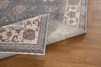 Gray traditional rug with ornate cream border and floral damask pattern