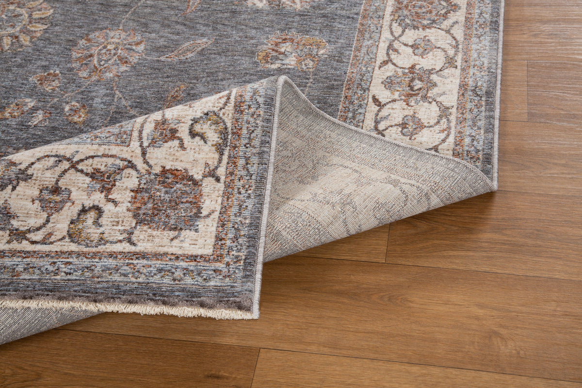 Gray traditional rug with ornate cream border and floral damask pattern
