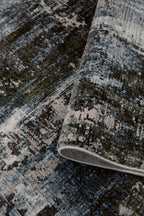 Abstract distressed rug with blue, grey and white textured pattern