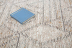 Modern geometric patterned rug in soft beige, grey and gold tones