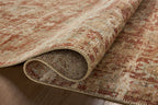 Vintage-style rug with faded terracotta and beige distressed floral pattern throughout