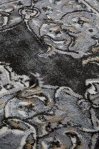 Ornate Persian-style rug with symmetrical medallion pattern in black, gray and cream tones