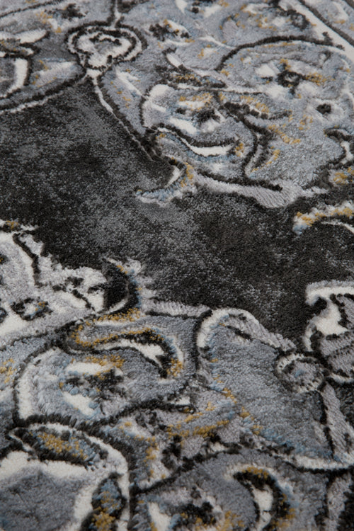 Ornate Persian-style rug with symmetrical medallion pattern in black, gray and cream tones