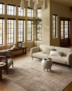 Beige traditional Persian-style rug with intricate geometric and floral patterns throughout