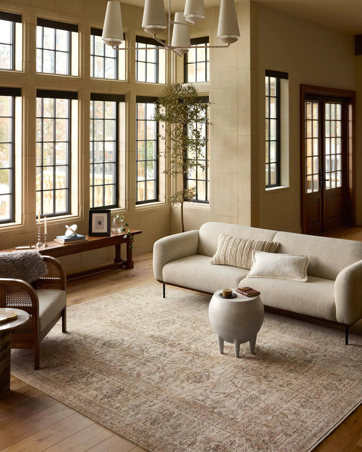 Beige traditional Persian-style rug with intricate geometric and floral patterns throughout