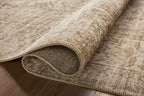 Beige traditional Persian-style rug with intricate geometric and floral patterns throughout