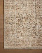 Beige traditional Persian-style rug with intricate geometric and floral patterns throughout