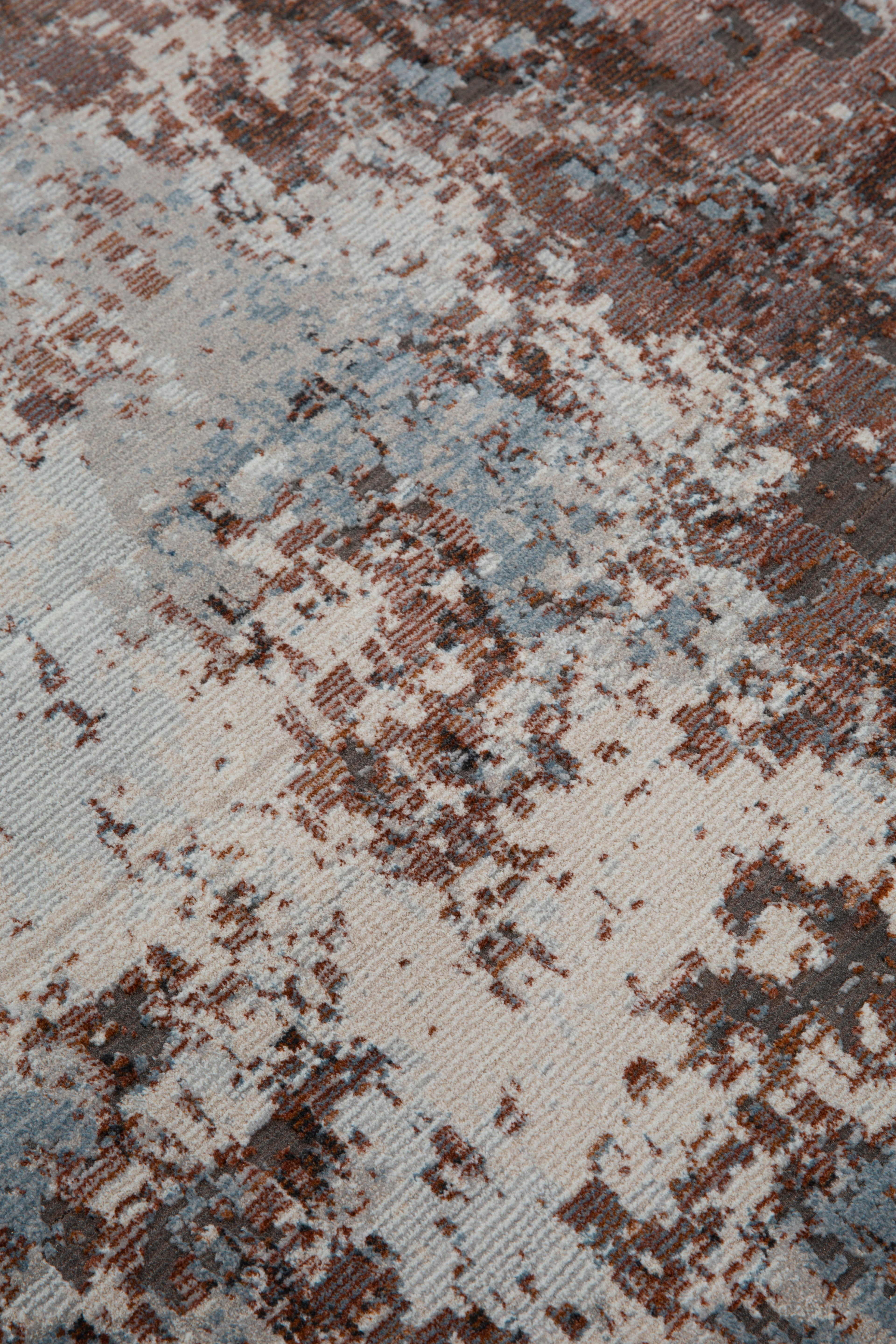 Modern distressed rug with brown, cream and blue abstract texture pattern