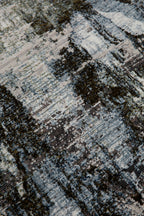 Abstract distressed rug with blue, grey and white textured pattern