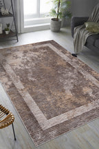 Modern geometric striped rug in grey, taupe and cream tones with distressed texture