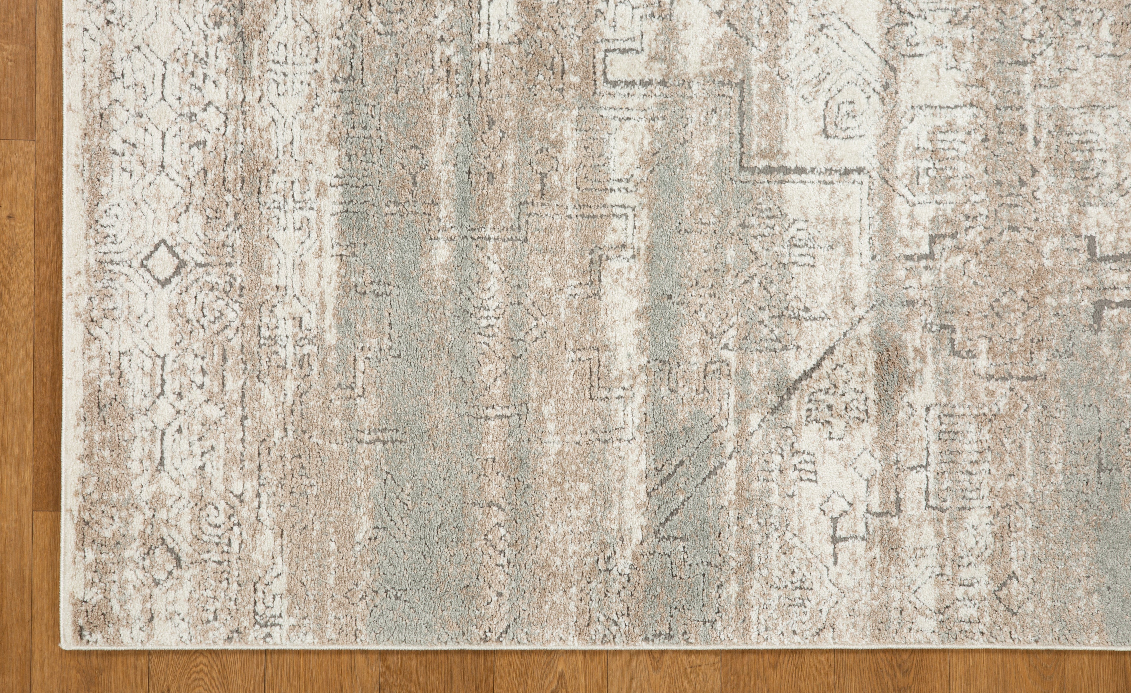 Vintage beige and grey distressed geometric patterned area rug with worn texture