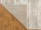 Vintage beige and grey distressed geometric patterned area rug with worn texture