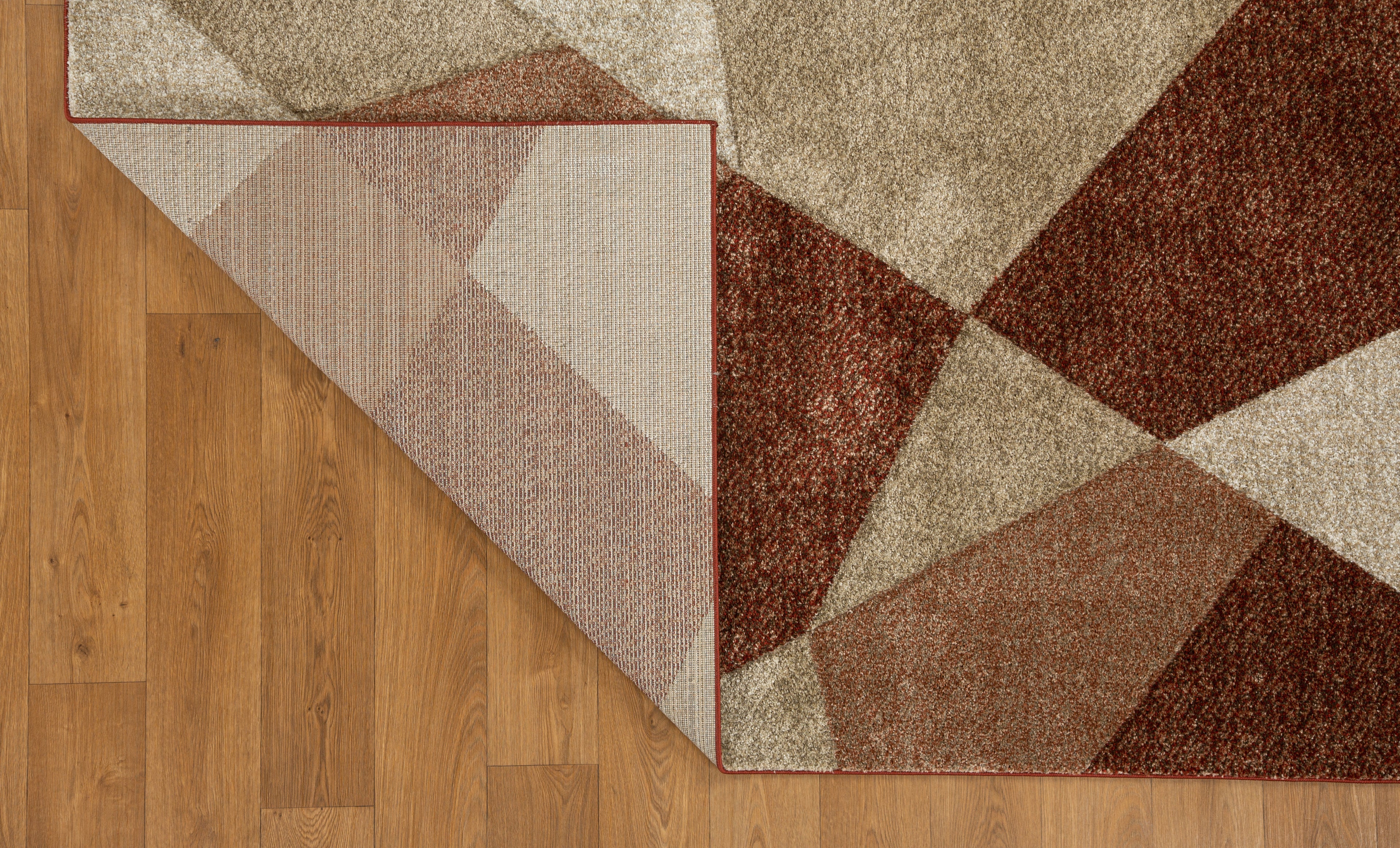 Brown and cream geometric diamond pattern area rug with textured weave