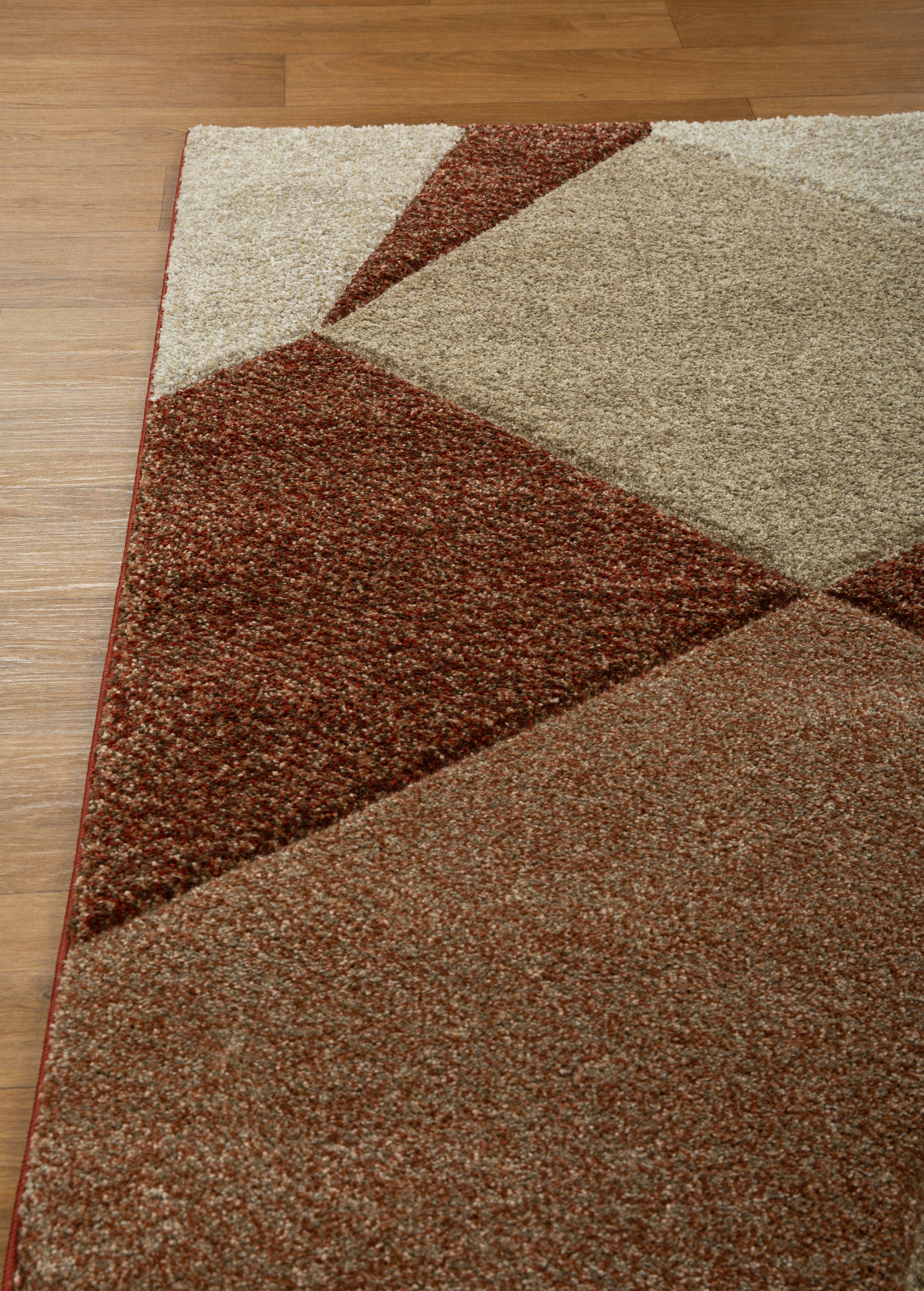 Brown and cream geometric diamond pattern area rug with textured weave