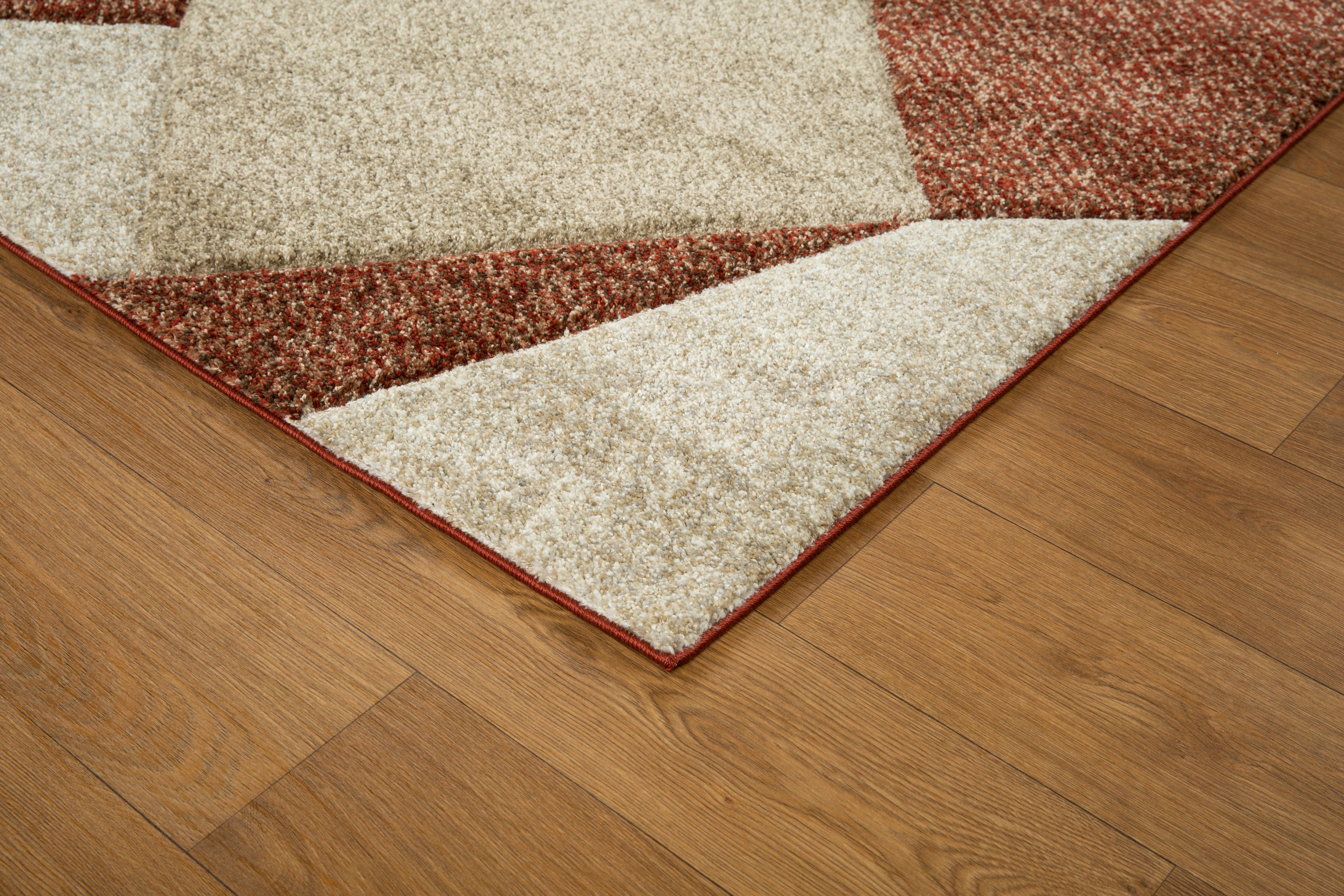 Brown and cream geometric diamond pattern area rug with textured weave