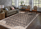Charcoal and beige damask patterned rug with ornate floral motifs and border