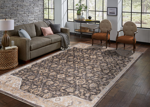 Charcoal and beige damask patterned rug with ornate floral motifs and border