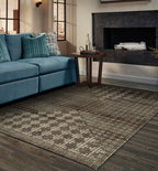 Brown and cream geometric patterned rug with textured weave design