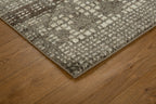 Brown and cream geometric patterned rug with textured weave design
