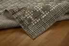 Brown and cream geometric patterned rug with textured weave design