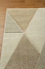Geometric beige and cream triangle pattern rug with textured wool pile