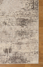 Modern abstract distressed rug with cream and charcoal gray textured pattern