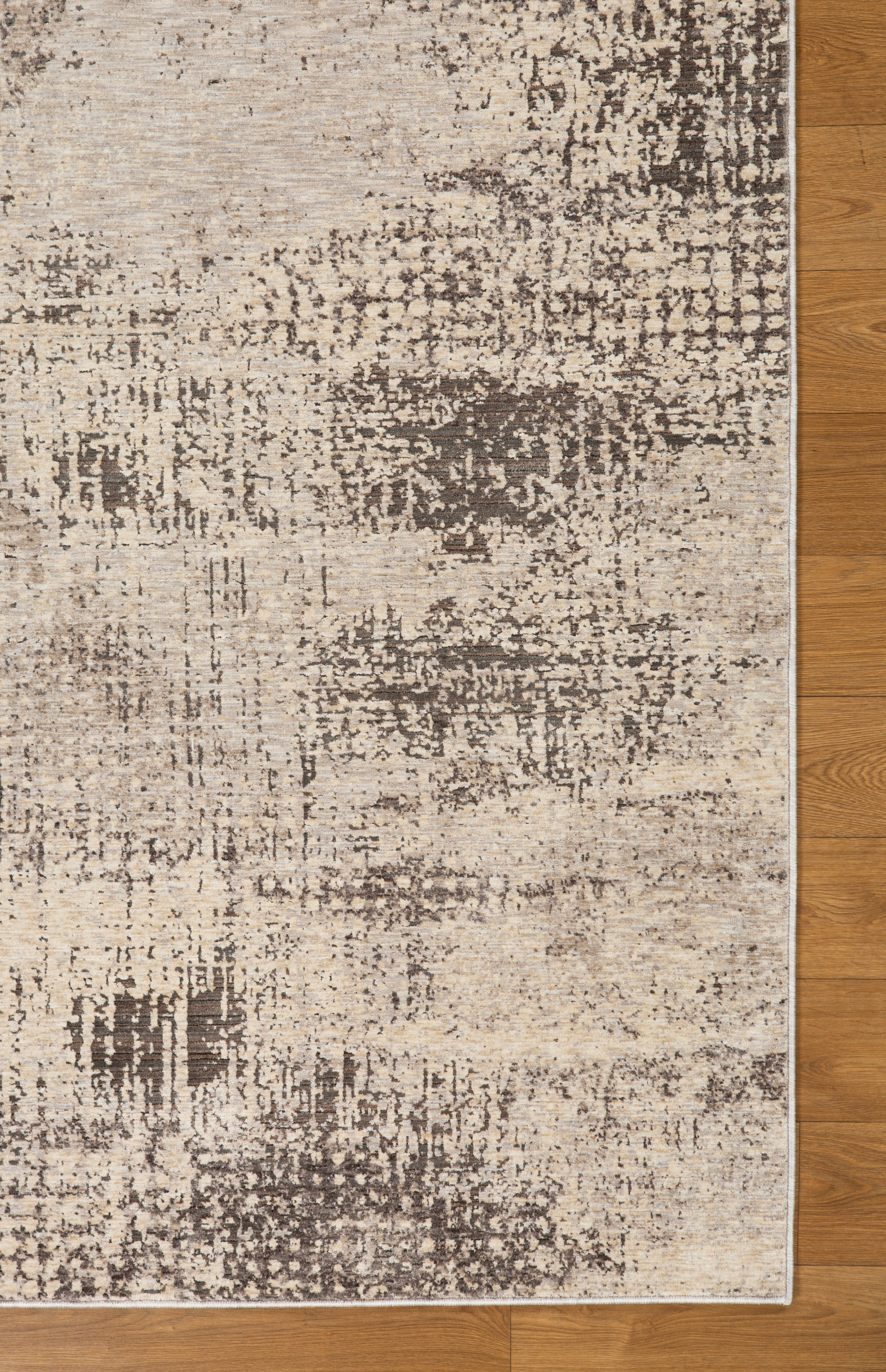 Modern abstract distressed rug with cream and charcoal gray textured pattern