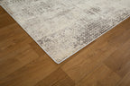 Modern abstract distressed rug with cream and charcoal gray textured pattern