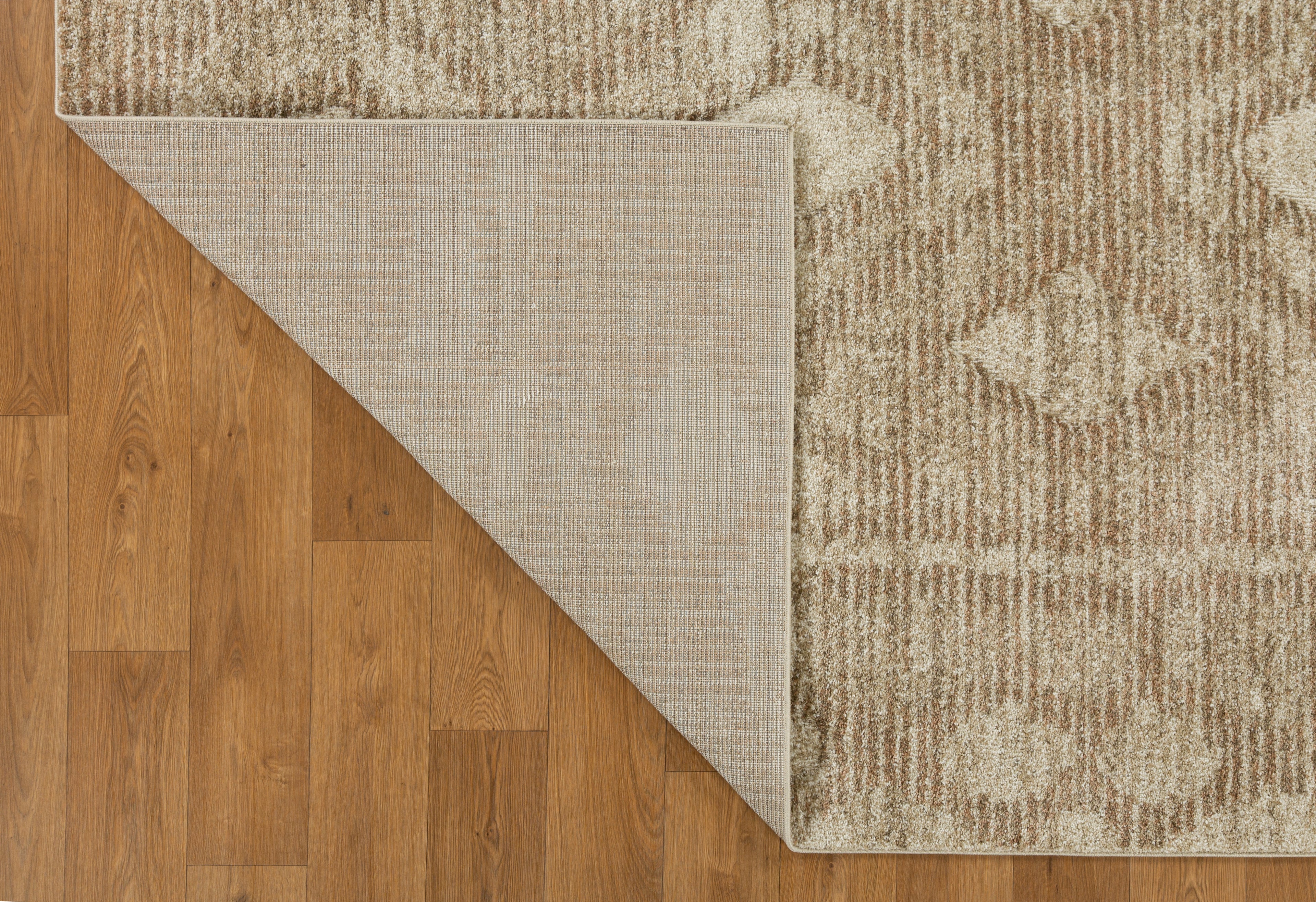 Beige and tan textured rug with subtle diamond pattern throughout