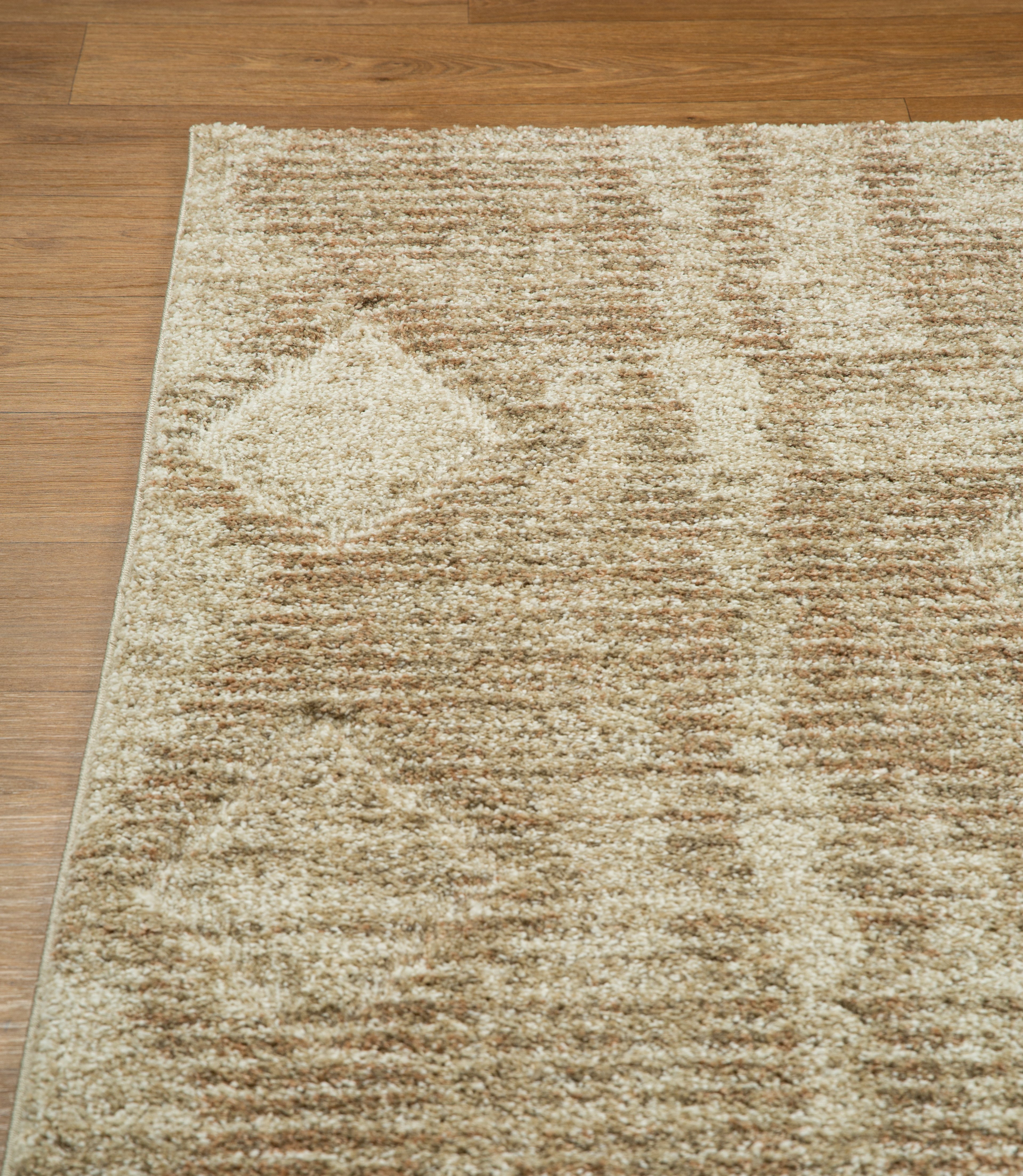 Beige and tan textured rug with subtle diamond pattern throughout