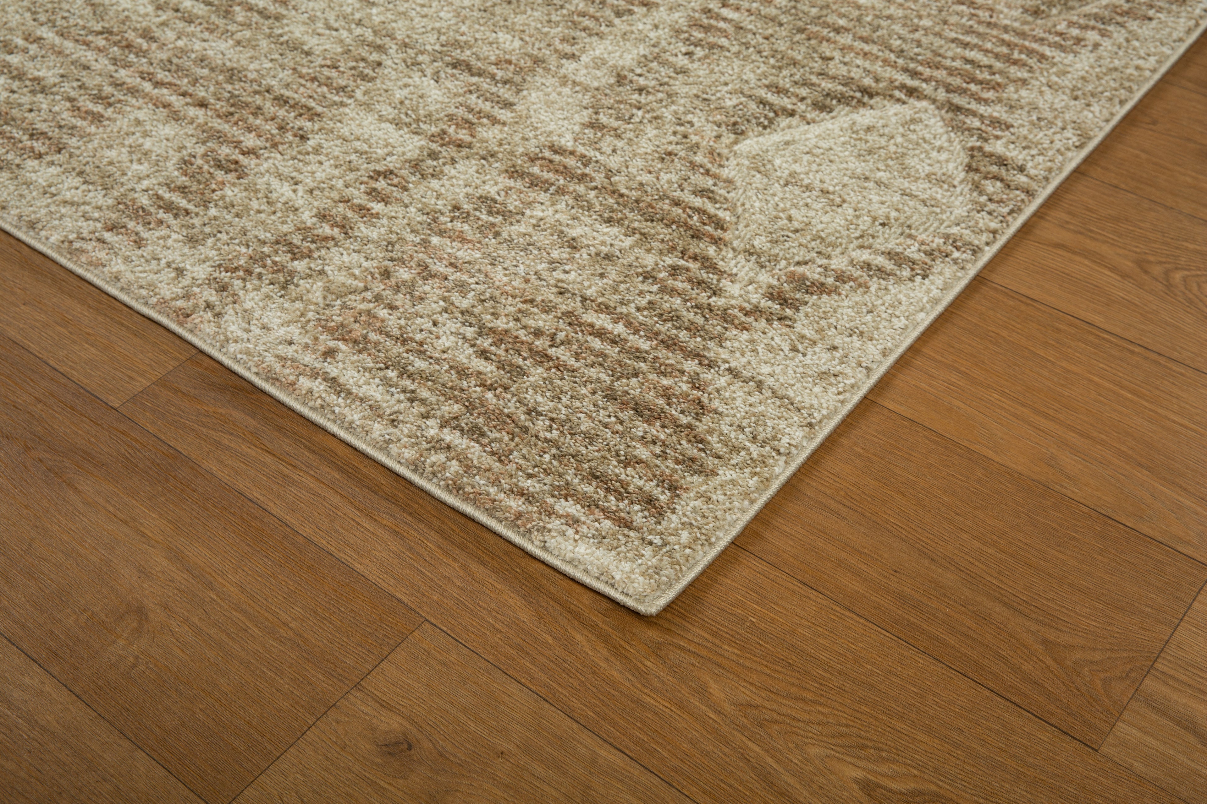 Beige and tan textured rug with subtle diamond pattern throughout