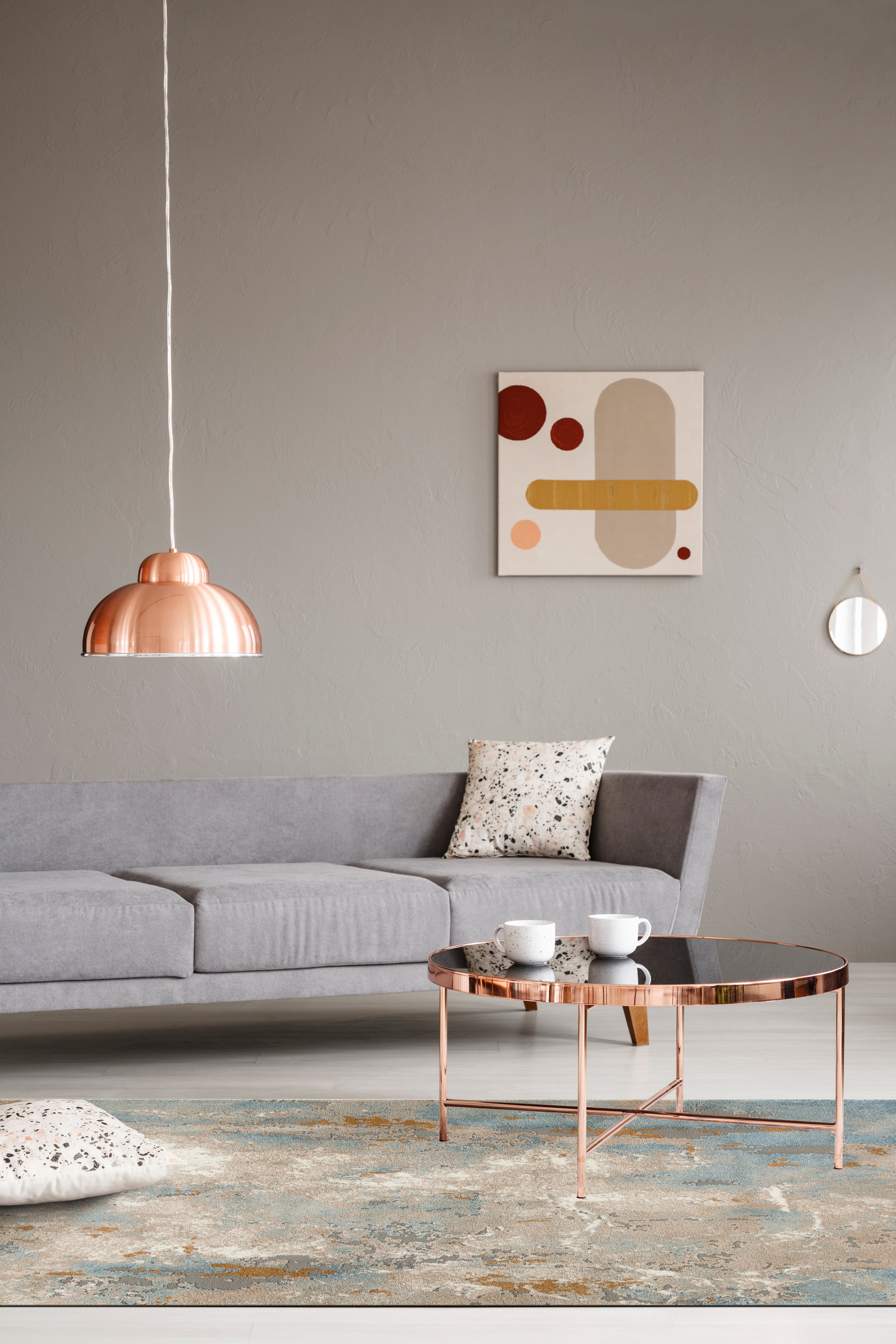 Abstract distressed rug with blue, gold, and cream tones in modern design