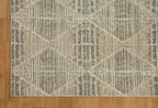 Neutral beige geometric patterned rug with textured woven appearance and diamond motifs