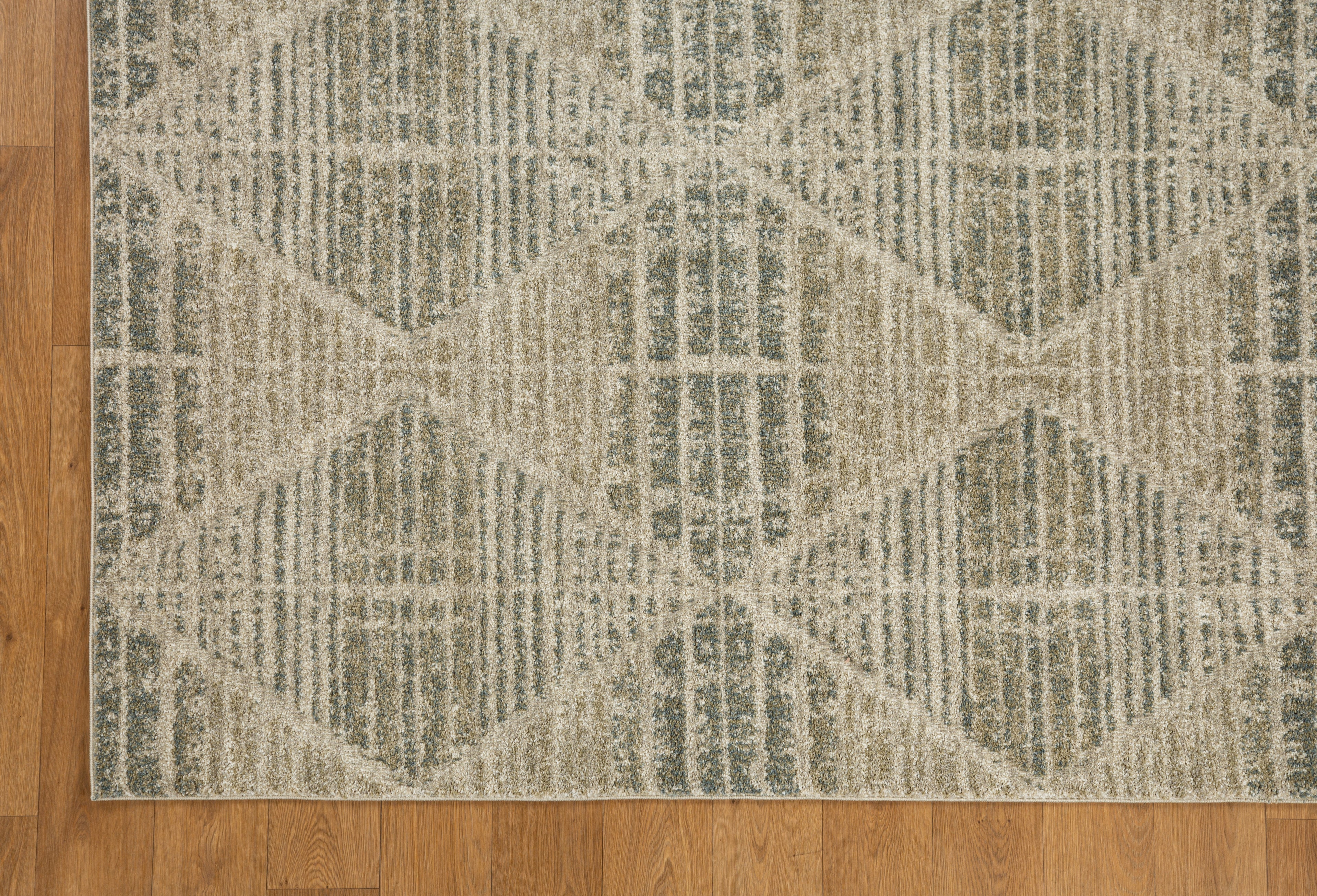 Neutral beige geometric patterned rug with textured woven appearance and diamond motifs