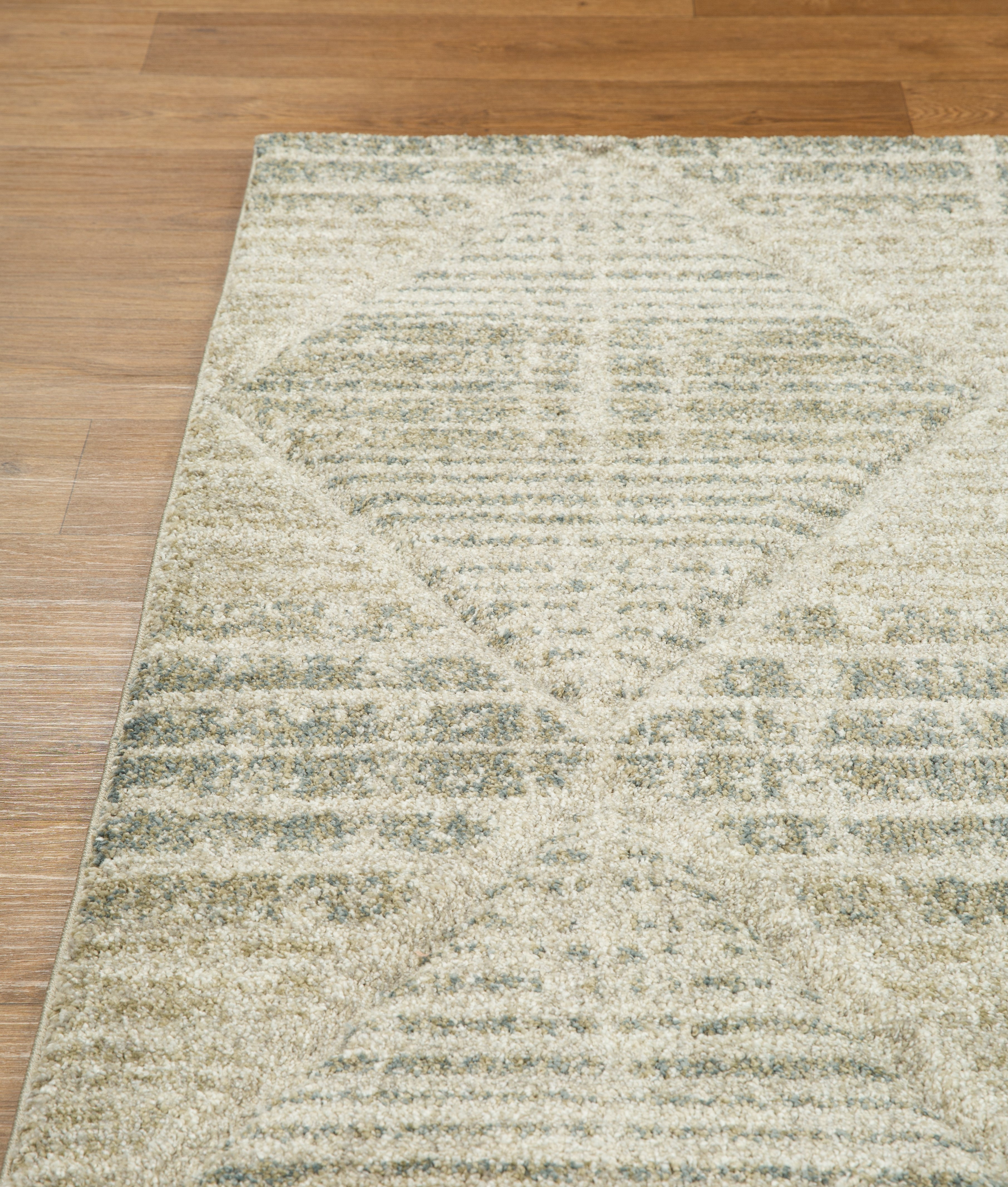 Neutral beige geometric patterned rug with textured woven appearance and diamond motifs
