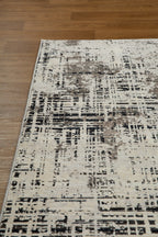 Modern distressed rug with abstract geometric pattern in cream and charcoal gray tones