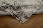 Modern distressed rug with abstract geometric pattern in cream and charcoal gray tones