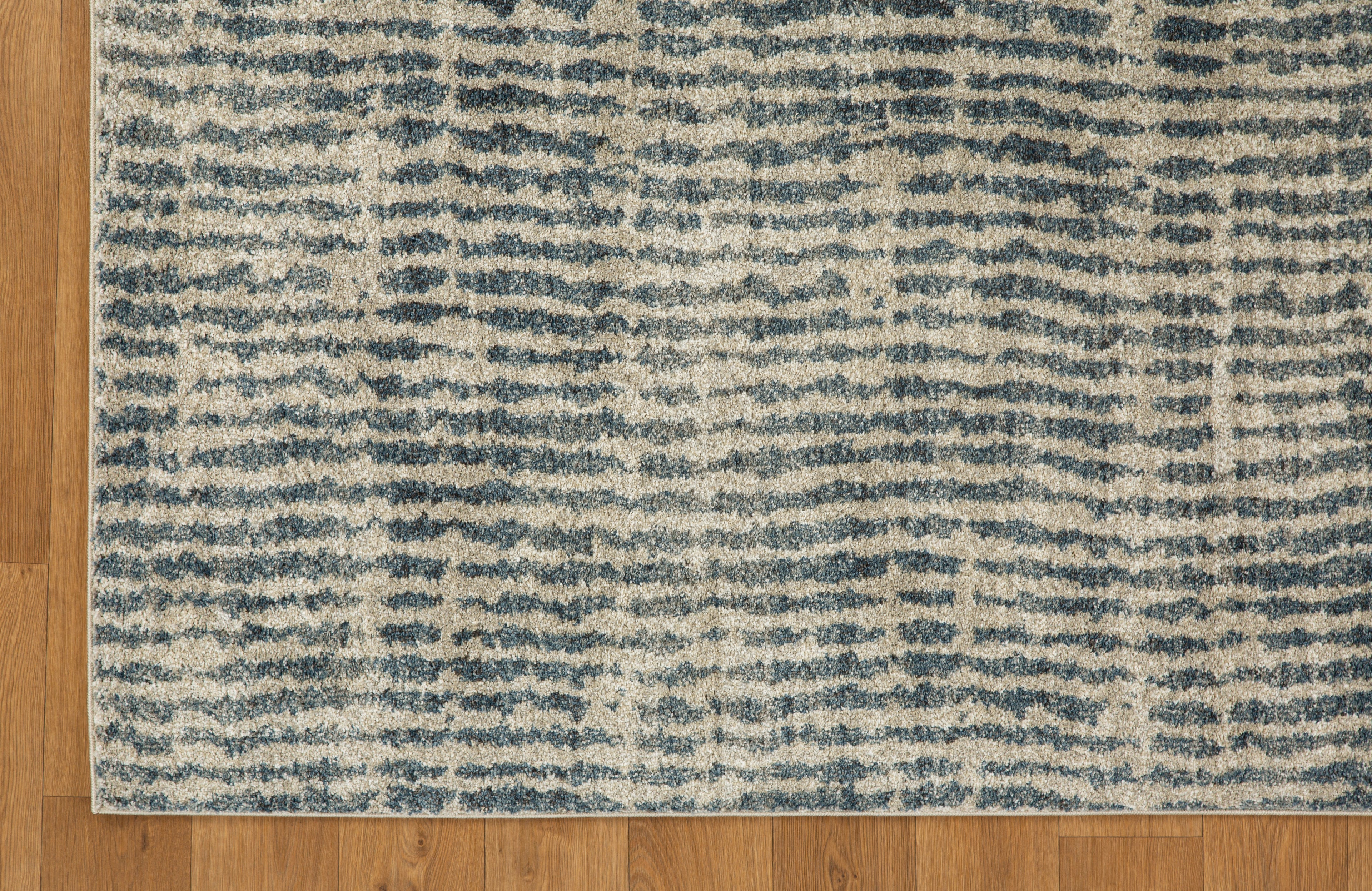 Grey and cream striped textured rug with abstract linear pattern design