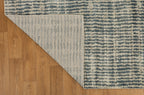 Grey and cream striped textured rug with abstract linear pattern design