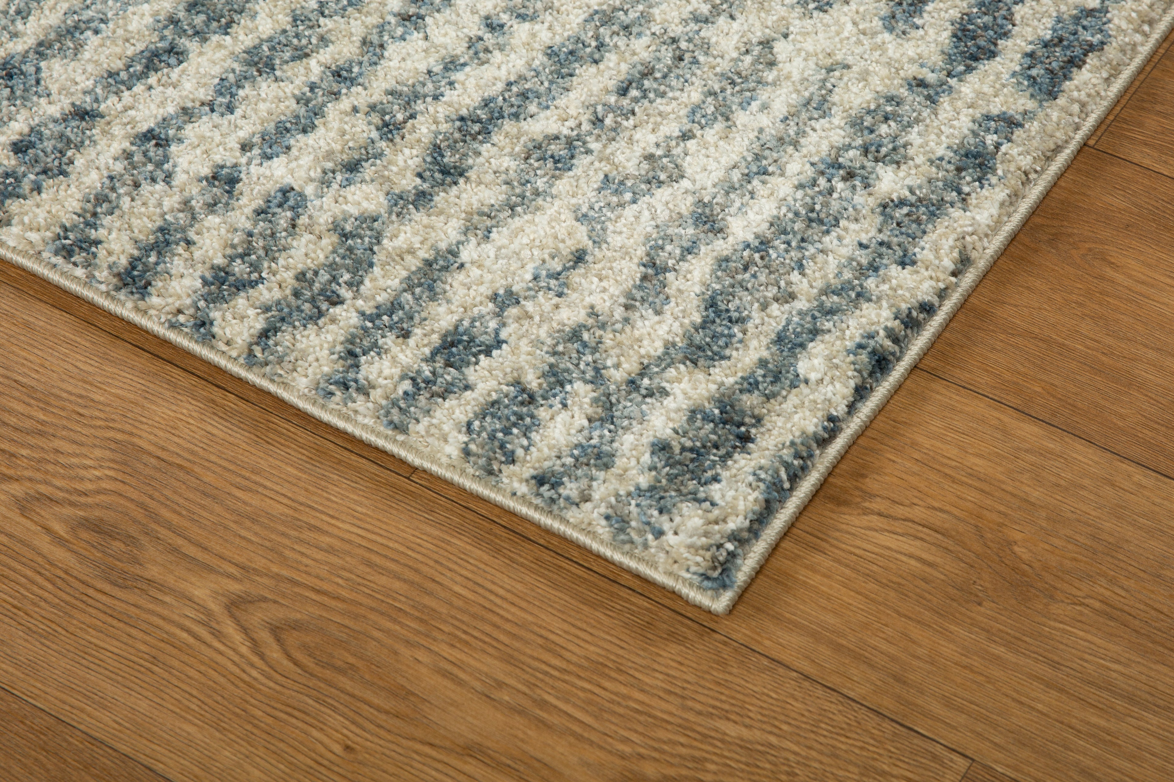 Grey and cream striped textured rug with abstract linear pattern design