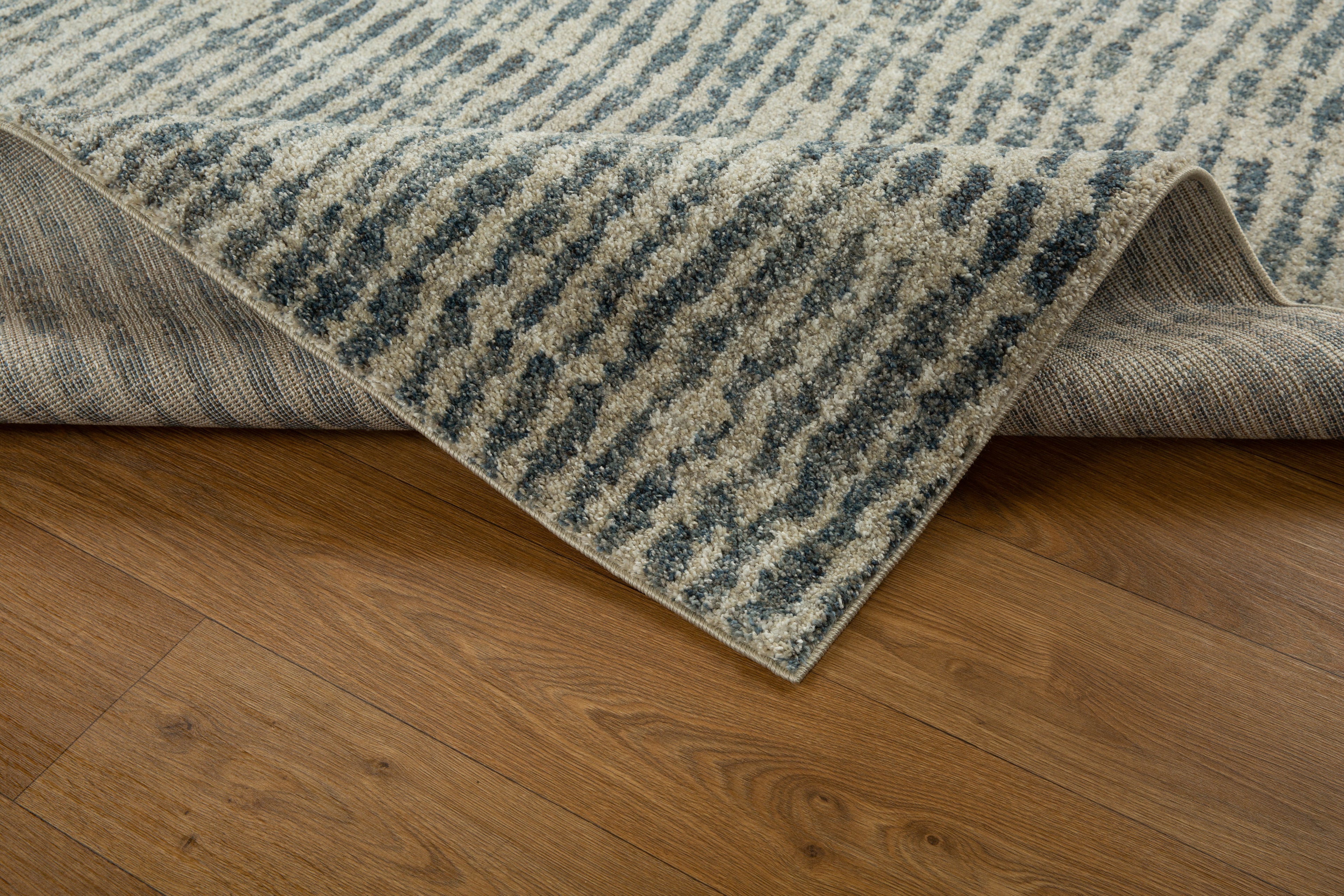 Grey and cream striped textured rug with abstract linear pattern design