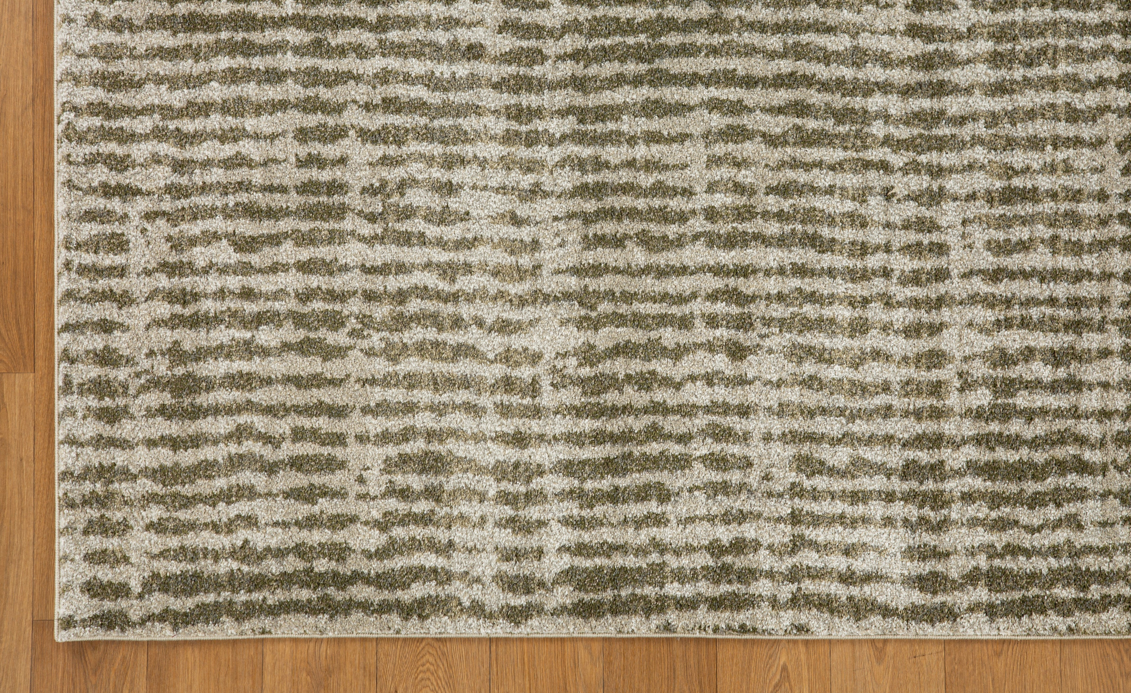 Neutral textured area rug with vertical striped pattern in beige and green tones